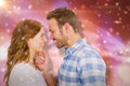 Composite image of happy young couple looking at each other and smiling Royalty Free Stock Photo