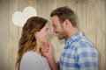 Composite image of happy young couple looking at each other and smiling Royalty Free Stock Photo