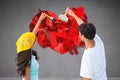 Composite image of happy young couple painting together Royalty Free Stock Photo