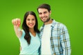 Composite image of happy young couple showing new house key Royalty Free Stock Photo