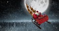 Composite image of high angle view of santa claus riding on sled with gift box Royalty Free Stock Photo