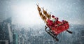 Composite image of high angle view of santa claus riding on sled with gift box Royalty Free Stock Photo