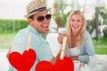 Composite image of hip young couple having coffee together Royalty Free Stock Photo