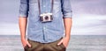 Composite image of hipster man holding digital camera Royalty Free Stock Photo