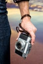 Composite image of hipster man holding digital camera Royalty Free Stock Photo