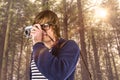 Composite image of hipster taking pictures with an old camera Royalty Free Stock Photo