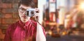 Composite image of hipster taking pictures with an old camera Royalty Free Stock Photo