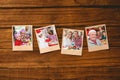 Composite image of instant photos on wooden floor Royalty Free Stock Photo