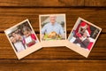 Composite image of instant photos on wooden floor Royalty Free Stock Photo