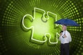 Composite image of jigsaw piece and businessman holding umbrella Royalty Free Stock Photo