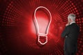Composite image of light bulb and businessman looking Royalty Free Stock Photo