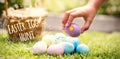 Composite image of little girl collecting easter eggs