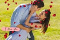 Composite image of loving and happy couple dancing in park Royalty Free Stock Photo