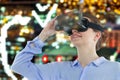 Composite image of low angle view of businesswoman using virtual reality headset Royalty Free Stock Photo