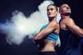 Composite image of low angle view of muscular man and woman Royalty Free Stock Photo