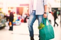 Composite image of low section of man holding bag with vegetables Royalty Free Stock Photo