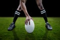 Composite image of low section of sportsman playing rugby