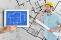 Composite image of male architect with blueprint talking on mobile phone Royalty Free Stock Photo