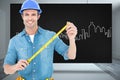 Composite image of male architect holding tape measure Royalty Free Stock Photo