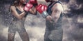 Composite image of male and female boxer with fighting stance Royalty Free Stock Photo