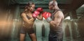 Composite image of male and female boxer with fighting stance Royalty Free Stock Photo