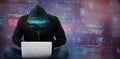 Composite image of male hacker using laptop Royalty Free Stock Photo