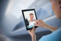 Composite image of male nurse using digital tablet