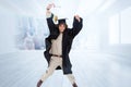 Composite image of male student in graduate robe jumping Royalty Free Stock Photo