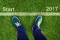 Composite image of man with canvas shoes on hardwood floor Royalty Free Stock Photo