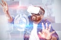 Composite image of man gesturing while using virtual reality headset Royalty Free Stock Photo