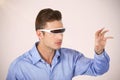 Composite image of man gesturing while using virtual video glasses Royalty Free Stock Photo