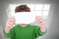 Composite image of man holding blank paper in front on face Royalty Free Stock Photo
