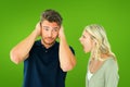 Composite image of man not listening to his shouting girlfriend Royalty Free Stock Photo