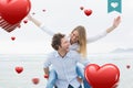 Composite image of man piggybacking woman at beach