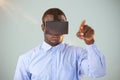 Composite image of man standing while wearing virtual reality headset Royalty Free Stock Photo