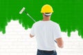 Composite image of man using paint roller Royalty Free Stock Photo