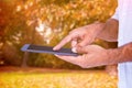 Composite image of a man using tablet computer Royalty Free Stock Photo