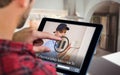 Composite image of man using tablet on wooden table Royalty Free Stock Photo