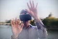 Composite image of man using a virtual reality device Royalty Free Stock Photo