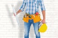 Composite image of manual worker holding spirit level Royalty Free Stock Photo
