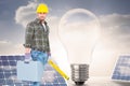 Composite image of manual worker with spirit level and toolbox Royalty Free Stock Photo