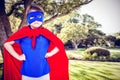 Composite image of masked girl pretending to be superhero