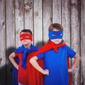 Composite image of masked kids pretending to be superheroes Royalty Free Stock Photo