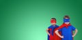 Composite image of masked kids pretending to be superheroes Royalty Free Stock Photo