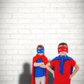 Composite image of masked kids pretending to be superheroes Royalty Free Stock Photo