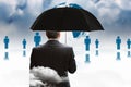 Composite image of mature businessman holding an umbrella Royalty Free Stock Photo