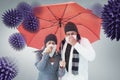 Composite image of mature couple blowing their noses under umbrella