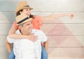 Composite image of mature man giving piggy back to woman Royalty Free Stock Photo