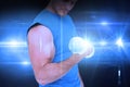 Composite image of mid section of a fit young man exercising with dumbbells Royalty Free Stock Photo