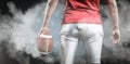 Composite image of mid section of sportsman with american football Royalty Free Stock Photo